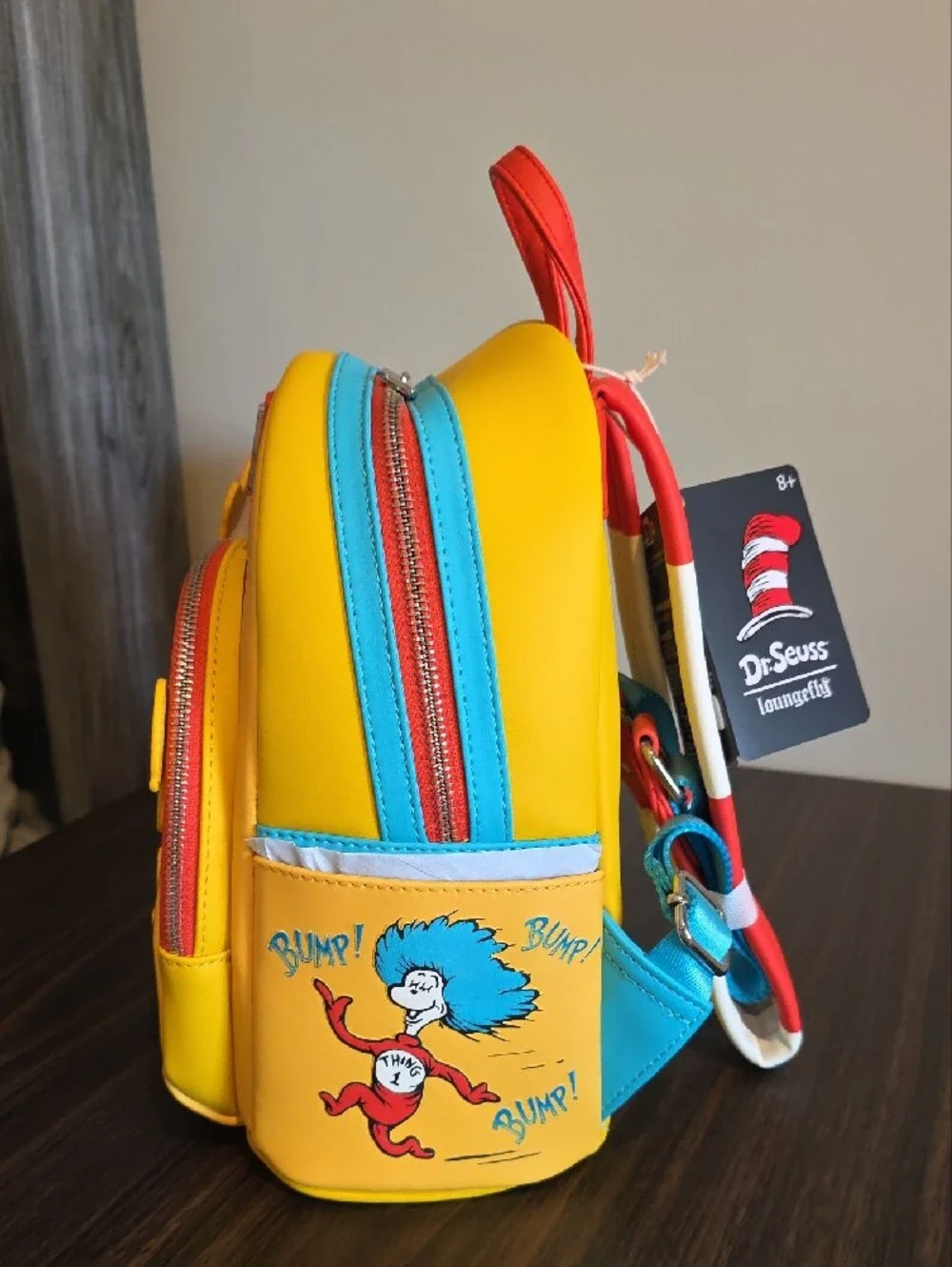 Loungefly Dr. Seuss Yellow Cat in the Hat Mini Backpack with Red & Blue Accents